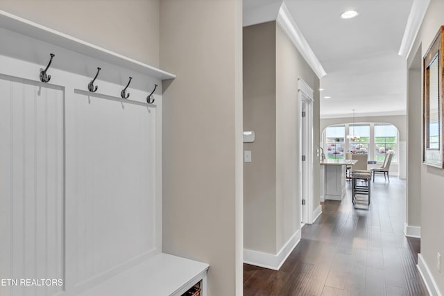 mudroom with recessed lighting, dark wood-type flooring, and baseboards