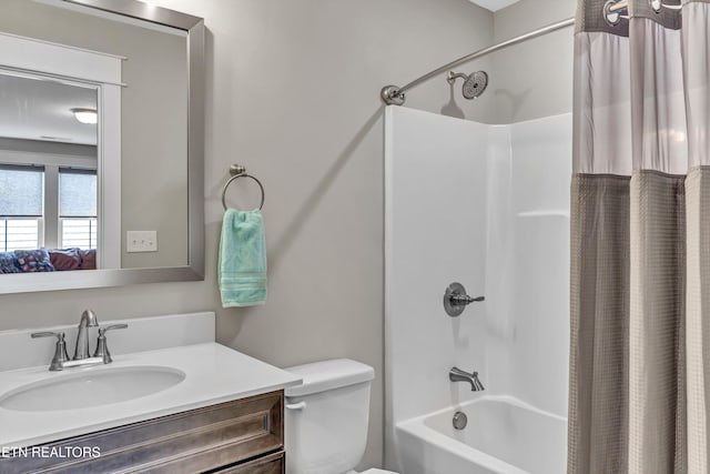 full bath featuring toilet, vanity, and shower / bathtub combination with curtain