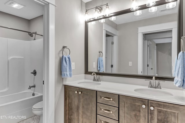 bathroom with a sink, visible vents, bathtub / shower combination, and double vanity