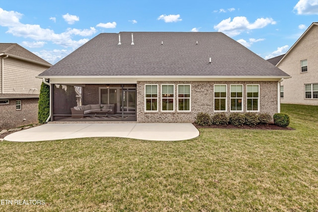 back of house featuring a yard, brick siding, outdoor lounge area, and a patio area