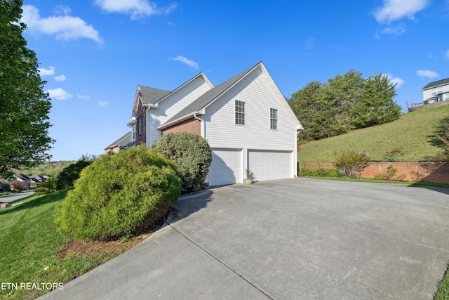 5633 Eagle Crest Ln, Knoxville, TN 37921 - view of property exterior featuring concrete driveway and an attached garage