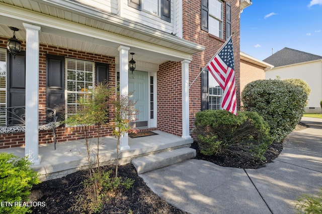 5633 Eagle Crest Ln, Knoxville, TN 37921 - property entrance with a porch and brick siding