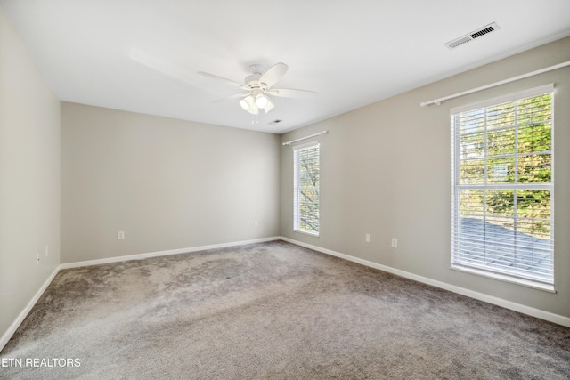 5633 Eagle Crest Ln, Knoxville, TN 37921 - empty room with visible vents, a wealth of natural light, ceiling fan, and baseboards
