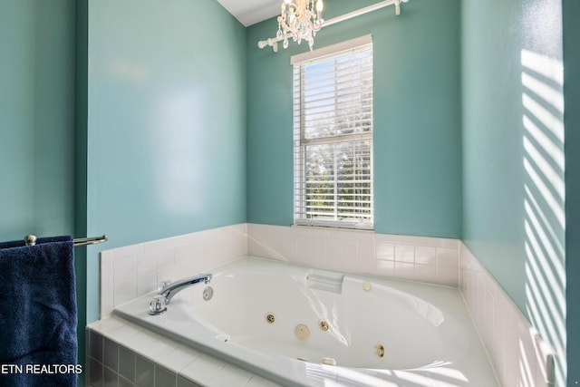 5633 Eagle Crest Ln, Knoxville, TN 37921 - full bathroom featuring plenty of natural light, a jetted tub, and a notable chandelier