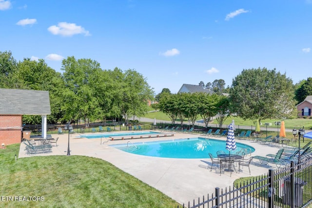 5633 Eagle Crest Ln, Knoxville, TN 37921 - community pool featuring a yard, a patio, and fence