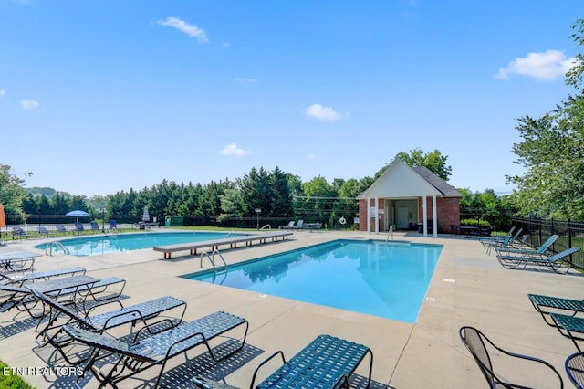 5633 Eagle Crest Ln, Knoxville, TN 37921 - pool with a patio area, fence, and an outdoor structure