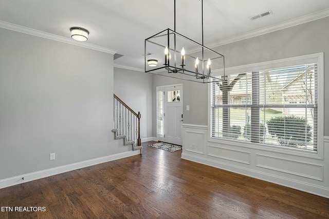 entryway featuring stairway, wood finished floors, visible vents, an inviting chandelier, and crown molding