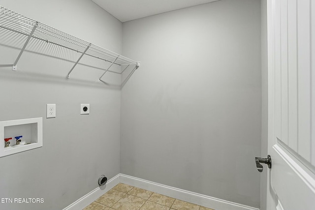 clothes washing area featuring hookup for a washing machine, light tile patterned floors, baseboards, laundry area, and electric dryer hookup