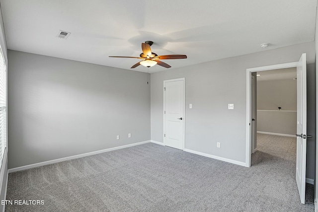 unfurnished bedroom featuring visible vents, ceiling fan, baseboards, and carpet