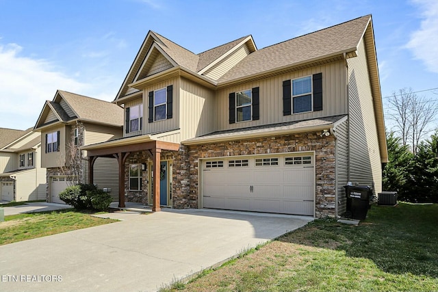 view of front of home featuring an attached garage, board and batten siding, and stone siding