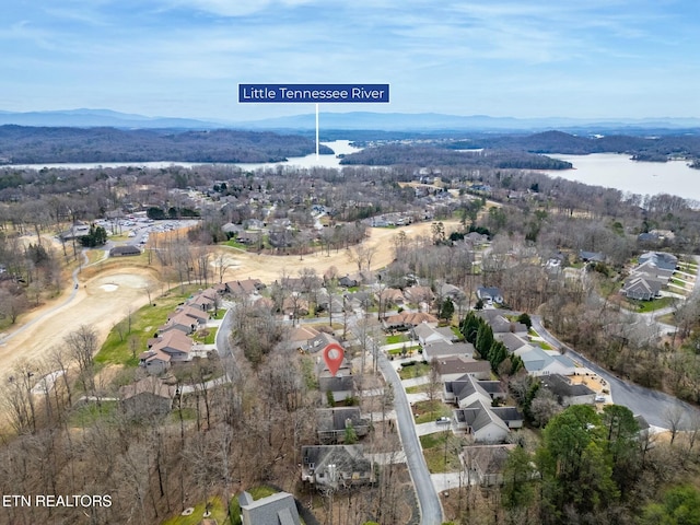 birds eye view of property featuring a residential view and a water view