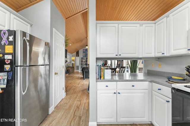 kitchen with white cabinetry, wood ceiling, electric stove, and freestanding refrigerator