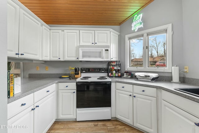 kitchen with white microwave, wood ceiling, light wood-type flooring, range with electric stovetop, and white cabinets