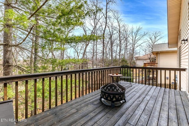 deck with an outdoor fire pit