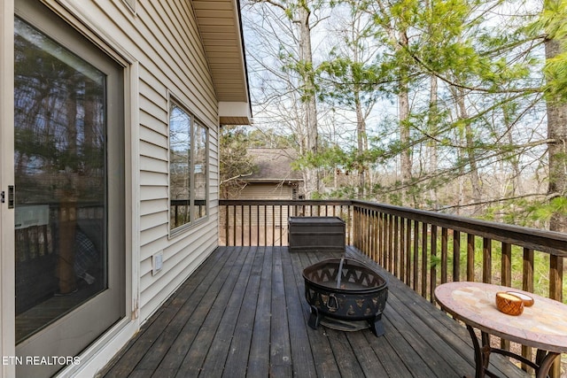 deck featuring an outdoor fire pit