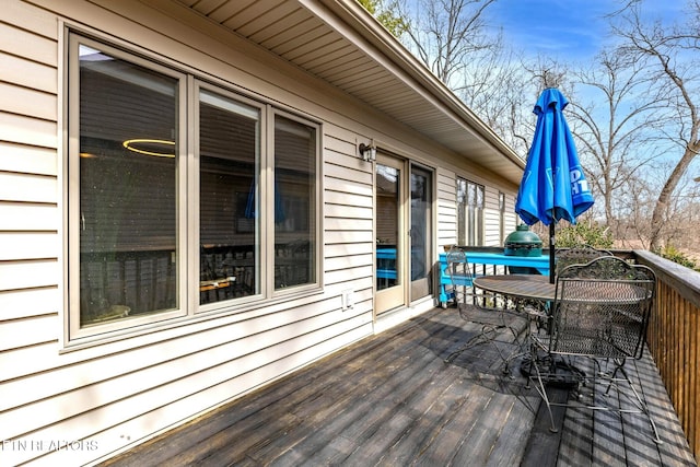 wooden deck with outdoor dining space