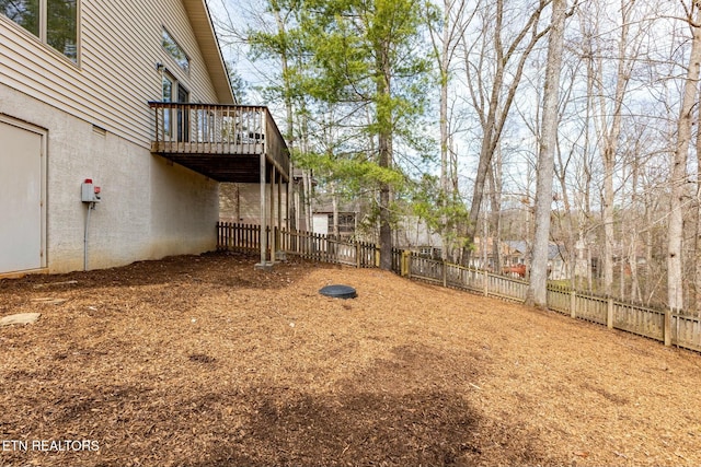 view of yard featuring a fenced backyard and a wooden deck