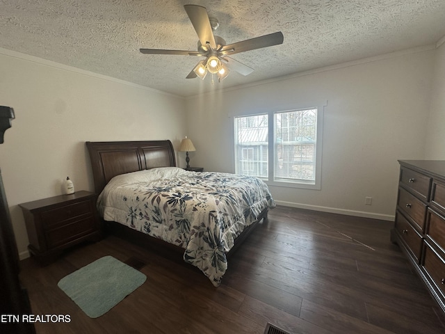 bedroom featuring crown molding, baseboards, dark wood finished floors, a textured ceiling, and a ceiling fan