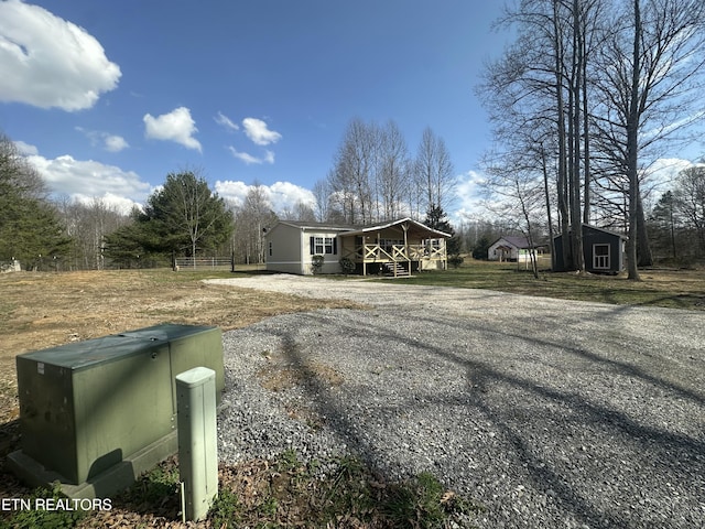 exterior space featuring an outdoor structure and driveway