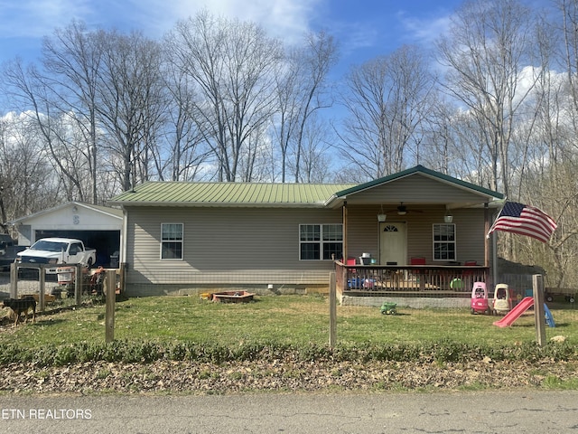 view of front facade with a ceiling fan, a porch, a front lawn, crawl space, and metal roof