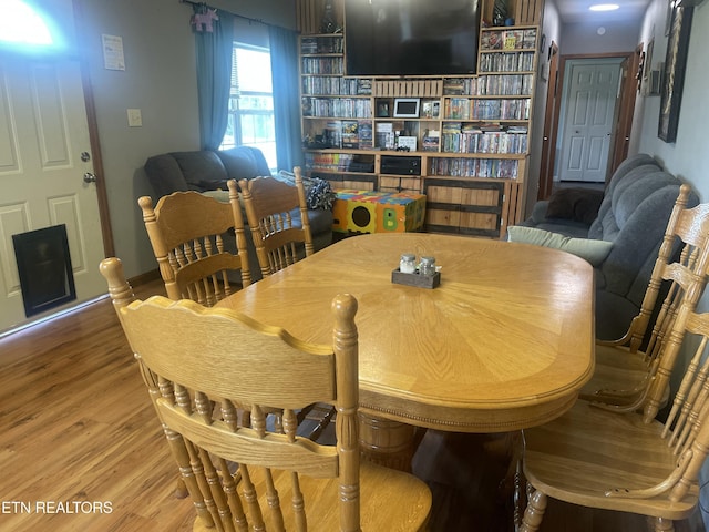 dining area with wood finished floors