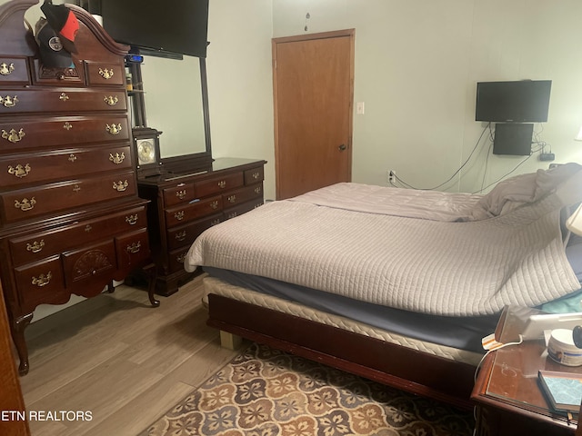 bedroom with light wood-style flooring