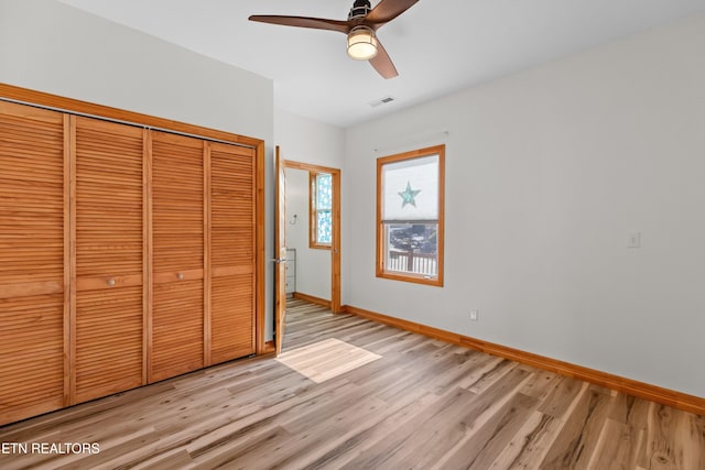 285 Redwood Dr, Dandridge, TN 37725 - unfurnished bedroom featuring light wood finished floors, a closet, and ceiling fan