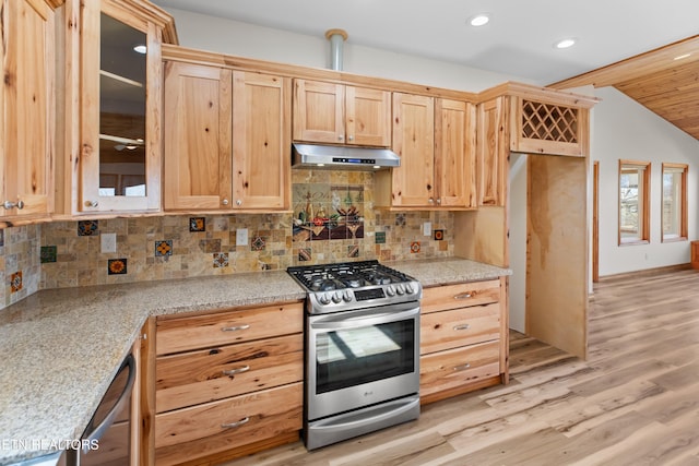 285 Redwood Dr, Dandridge, TN 37725 - kitchen featuring appliances with stainless steel finishes, under cabinet range hood, vaulted ceiling, tasteful backsplash, and light wood finished floors