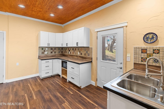 285 Redwood Dr, Dandridge, TN 37725 - kitchen with dark countertops, white cabinetry, tasteful backsplash, recessed lighting, and ornamental molding