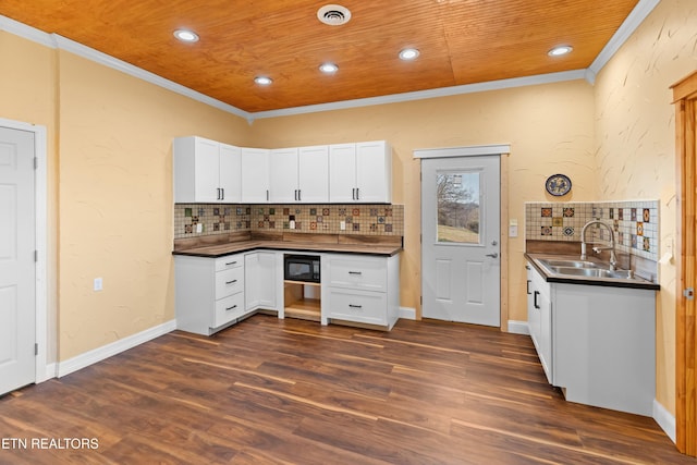 285 Redwood Dr, Dandridge, TN 37725 - kitchen featuring crown molding, dark countertops, backsplash, white cabinetry, and recessed lighting