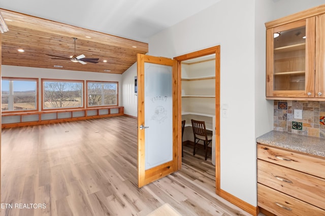 285 Redwood Dr, Dandridge, TN 37725 - kitchen featuring light wood-style floors, tasteful backsplash, lofted ceiling, a ceiling fan, and light stone counters