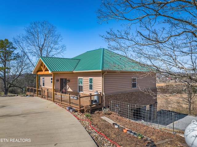285 Redwood Dr, Dandridge, TN 37725 - chalet / cabin with stone siding and a metal roof