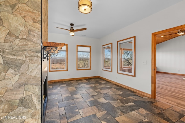 285 Redwood Dr, Dandridge, TN 37725 - unfurnished room featuring a ceiling fan and dark stone finish flooring
