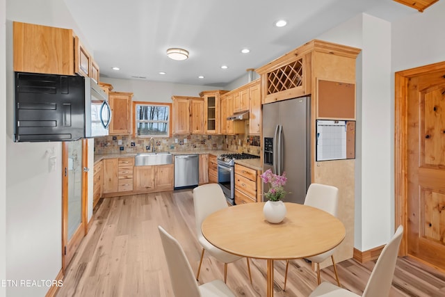 285 Redwood Dr, Dandridge, TN 37725 - kitchen with appliances with stainless steel finishes, under cabinet range hood, light wood finished floors, light brown cabinetry, and recessed lighting