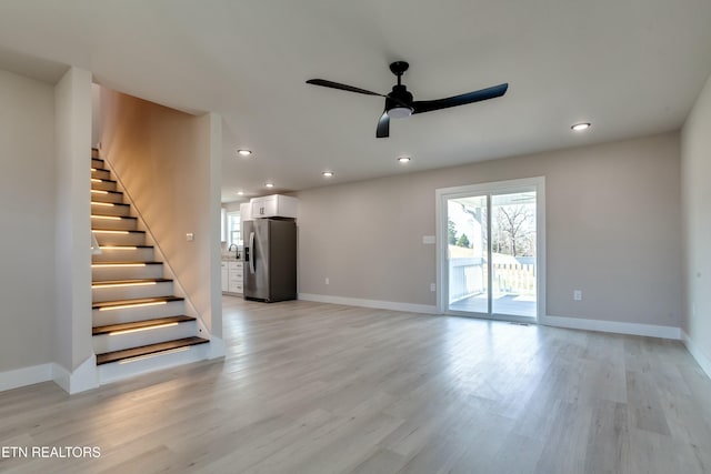 unfurnished living room featuring recessed lighting, a ceiling fan, and light wood-style floors