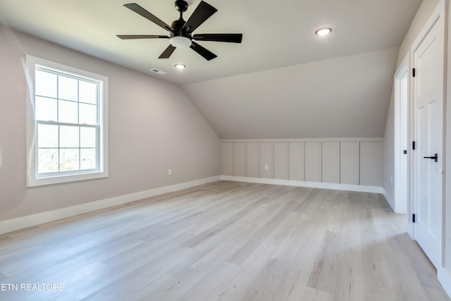 bonus room featuring baseboards, ceiling fan, lofted ceiling, recessed lighting, and light wood-style flooring