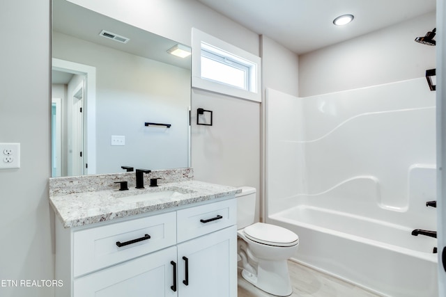 full bath featuring visible vents, toilet, shower / bath combination, wood finished floors, and vanity