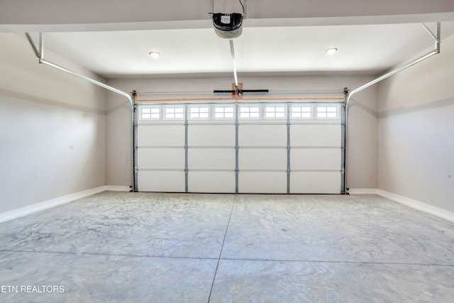 garage featuring baseboards and a garage door opener