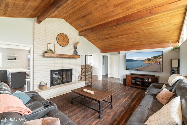 living area with beamed ceiling, high vaulted ceiling, wood ceiling, wood finished floors, and a brick fireplace