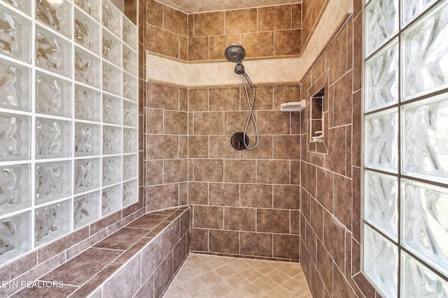 full bath featuring tiled shower