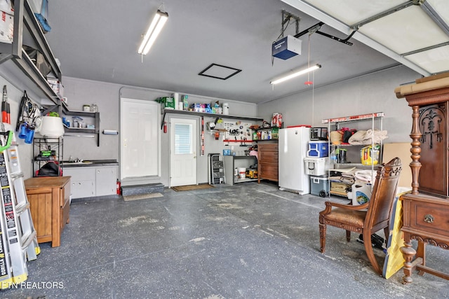 garage featuring a workshop area and a garage door opener