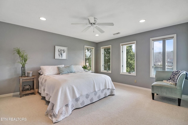 bedroom featuring recessed lighting, visible vents, light colored carpet, and baseboards