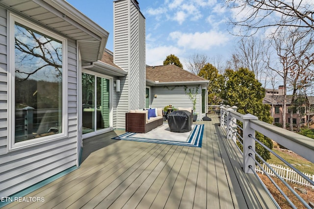 wooden deck with an outdoor hangout area