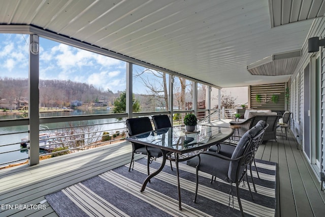 sunroom with a water view