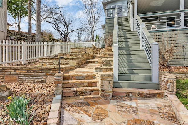 view of exterior entry with fence