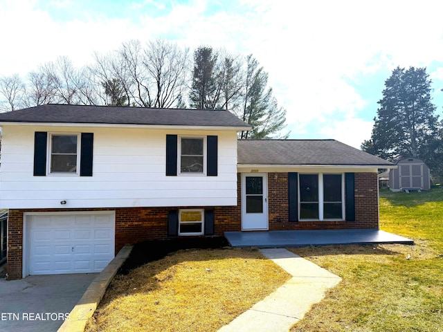 split level home featuring a storage shed, an attached garage, brick siding, and a front lawn