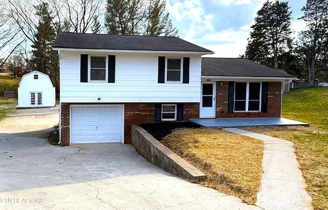 tri-level home with brick siding, concrete driveway, a garage, and a shingled roof