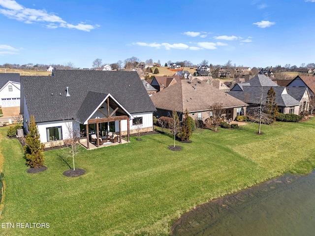 birds eye view of property with a residential view