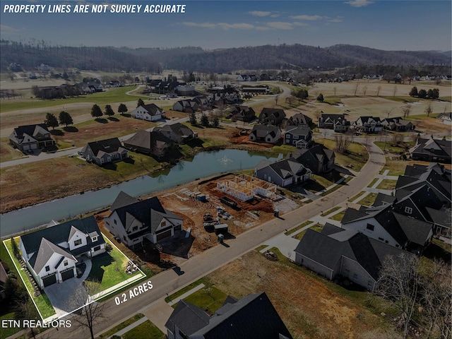 aerial view with a residential view and a water view