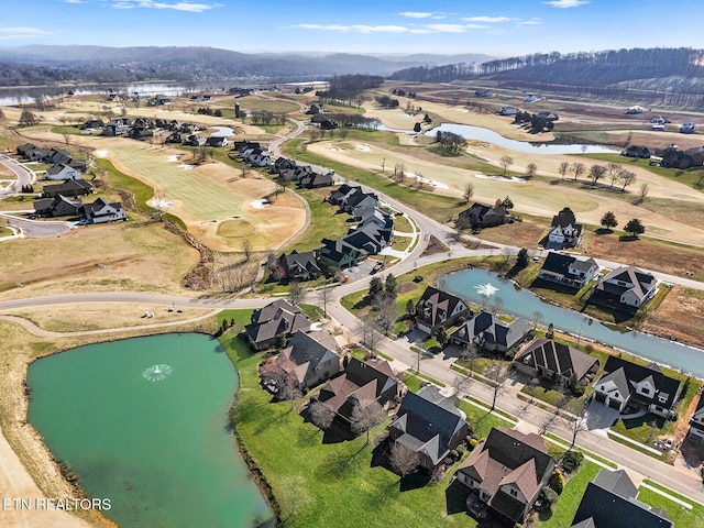 drone / aerial view featuring a water view and a residential view
